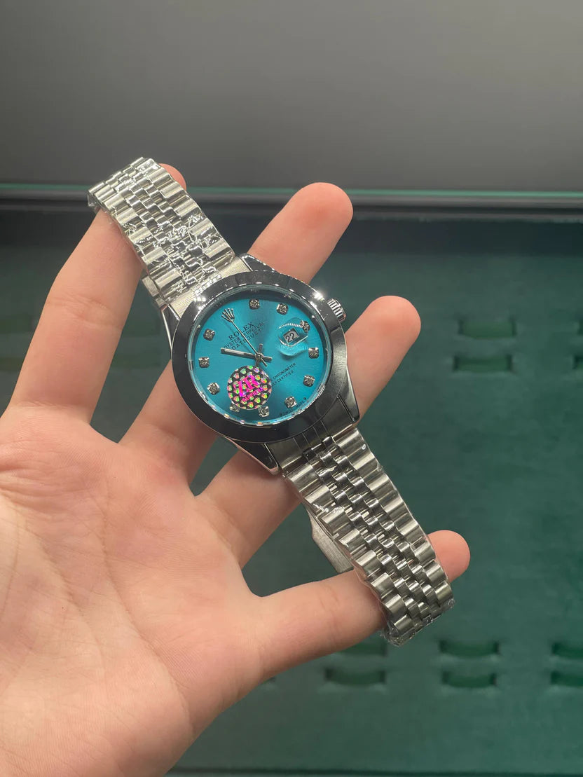 RLX Stainless Steel Dress Watch with Teal Blue Diamond Dial, Smooth Bezel, and Jubilee Bracelet